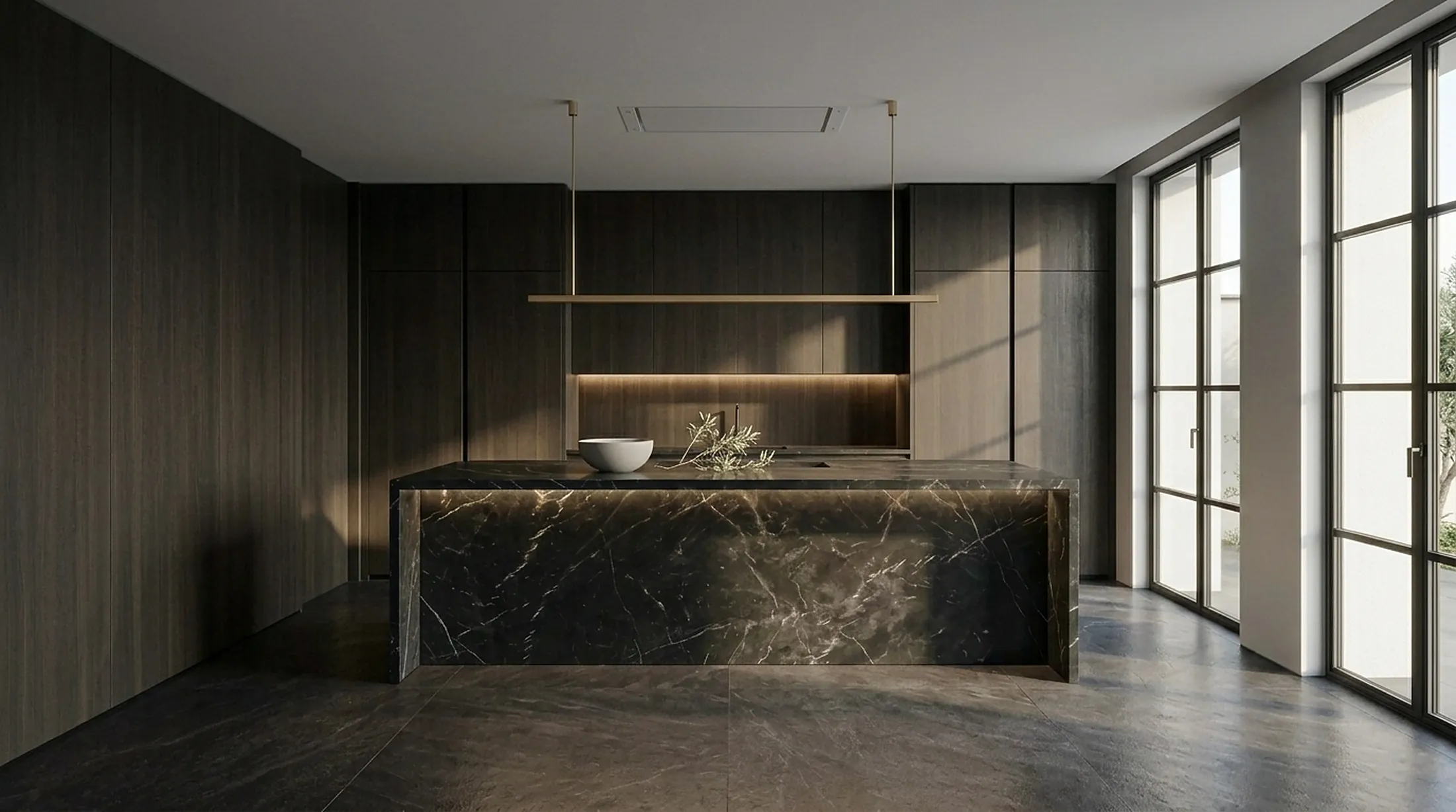 Dark walnut kitchen with a black marble island in daylight